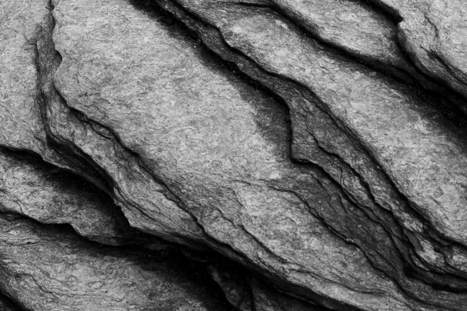 Weathered slate rock lit from the side